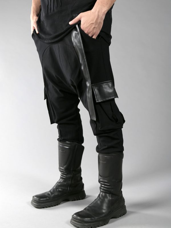 Black long loose pants for men designed with eco-leather and 2 pockets on the side