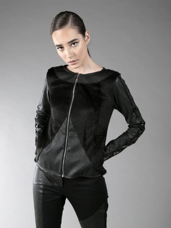 Black short jacket designed with fake leather. With lining.