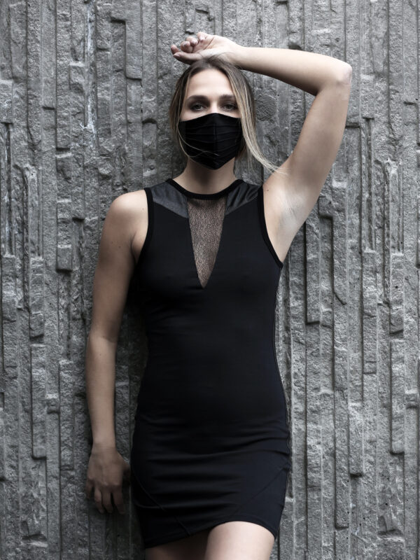 Black cotton lycra dress designed with vegan leather and transparent net.
