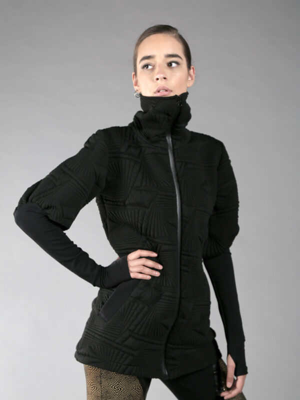 one layered thick women jacket with 2 pockets, long torso fit, finger holes, high neck.