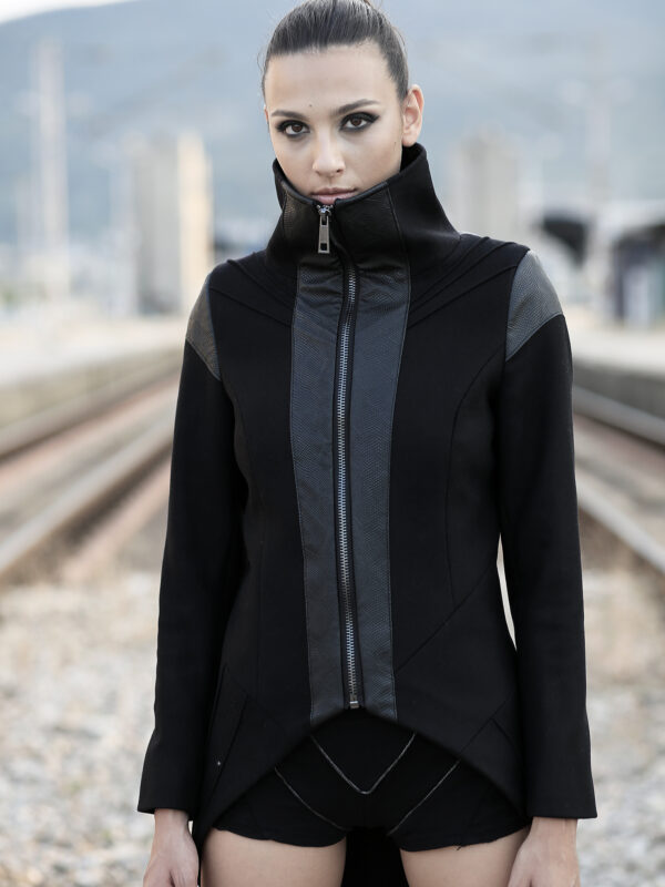 Black woman coat made of quality blend wool felt designed with faux leather, with lining. No pockets as it’s slim fit coat. Matches best with alternative, futuristic and asymmetric fashion styles.