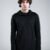 Black Sovereign Top by Kali Rose featuring an asymmetric silhouette, hood, long sleeves with thumbholes and distinctive pinch-stitch detailing, front and back views.