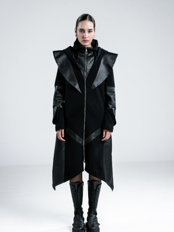 Ashfall Coat, women's long black asymmetric wool coat with oversized hood, high collar, faux-leather panels and full-length zipper.
